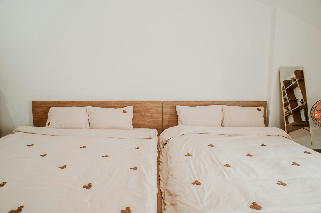 Scandinavian sleep method bed setup with two separate duvets to prevent partner heat clash